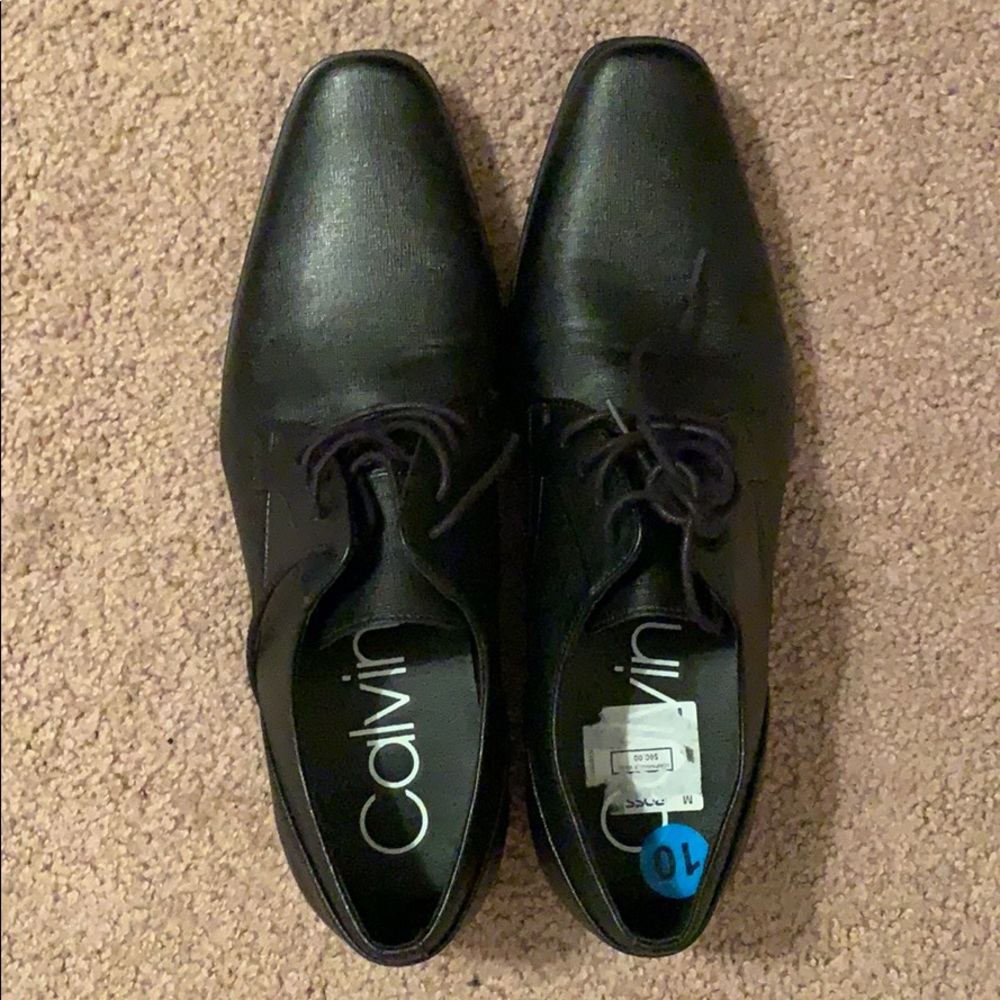 All black Calvin Klein dress shoes